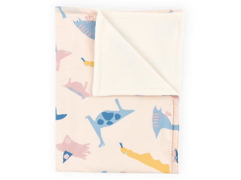 Couverture bébé dinosaure de Zoe sur beige