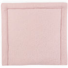 Eine rosa KraftKids Wickelauflage Musselin mit goldenen Punkten auf rosa, ideal um jede Wickelkommode stilvoll zu ergänzen.