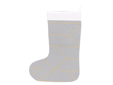 Lignes d'or de chaussette de Noël sur le gris